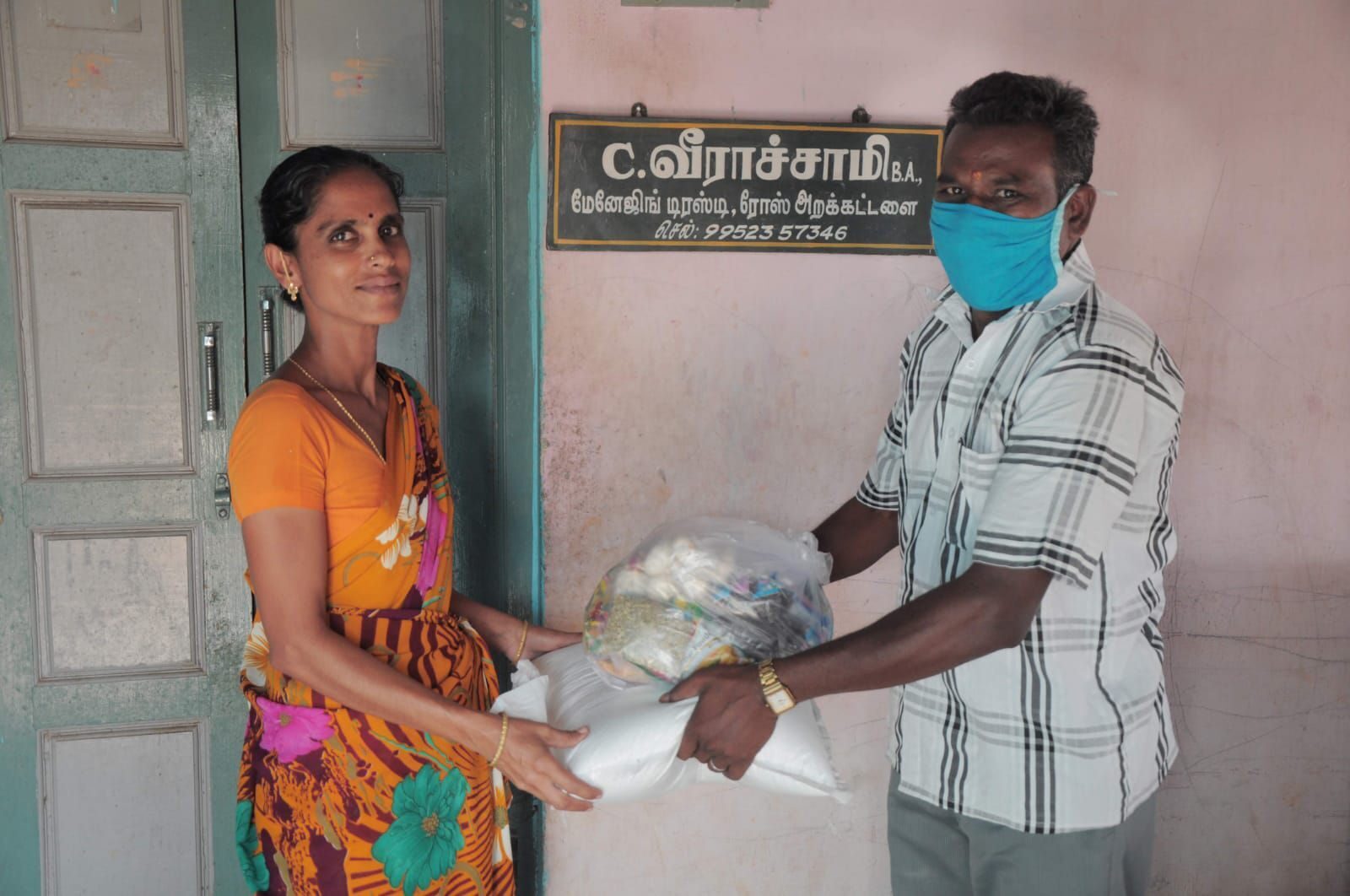 Relief material being distributed to an elderly resident